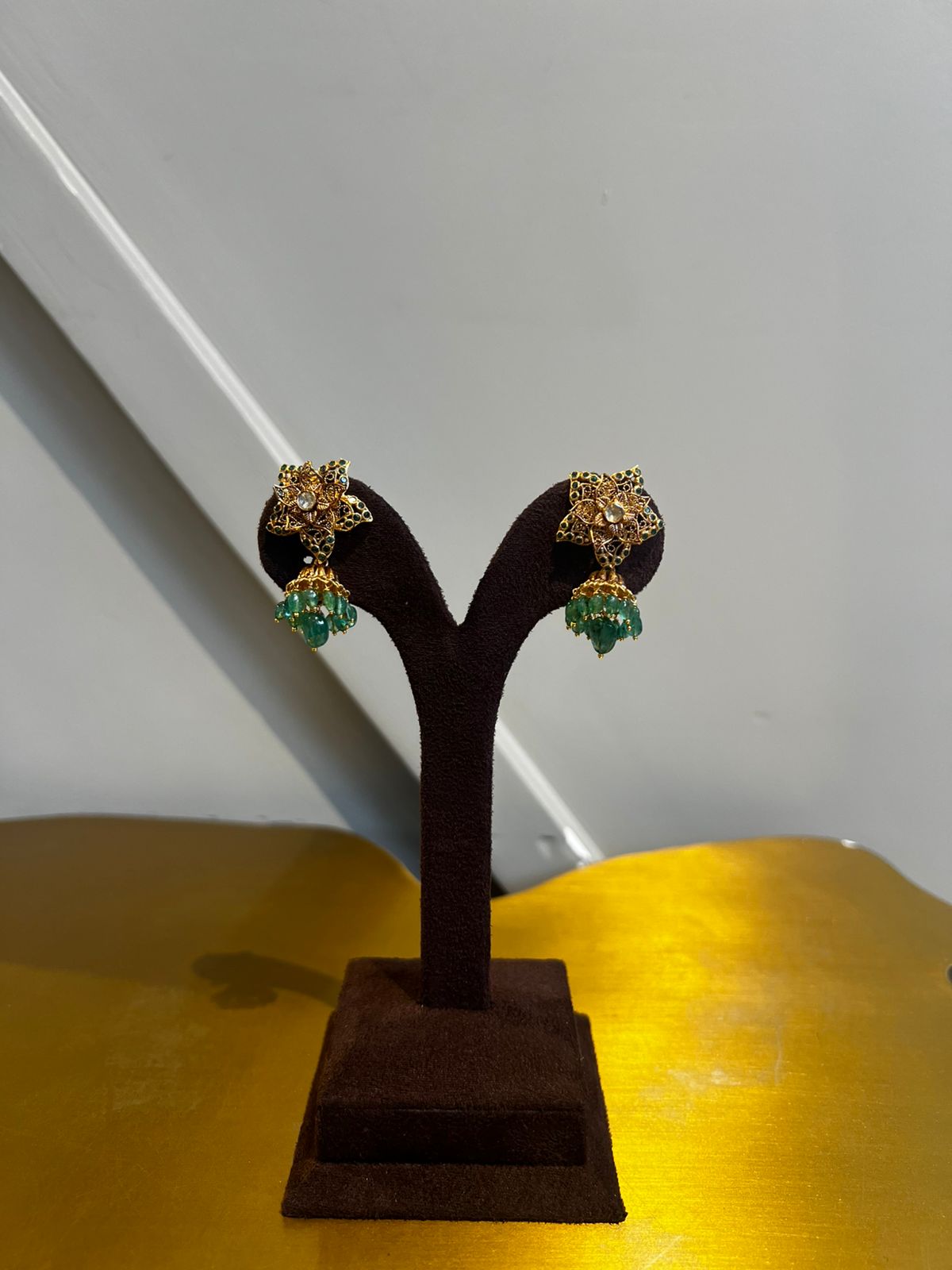 Star-Shaped Polki Earrings with Emerald Beads Star-Shaped Polki Earrings with Emerald Beads