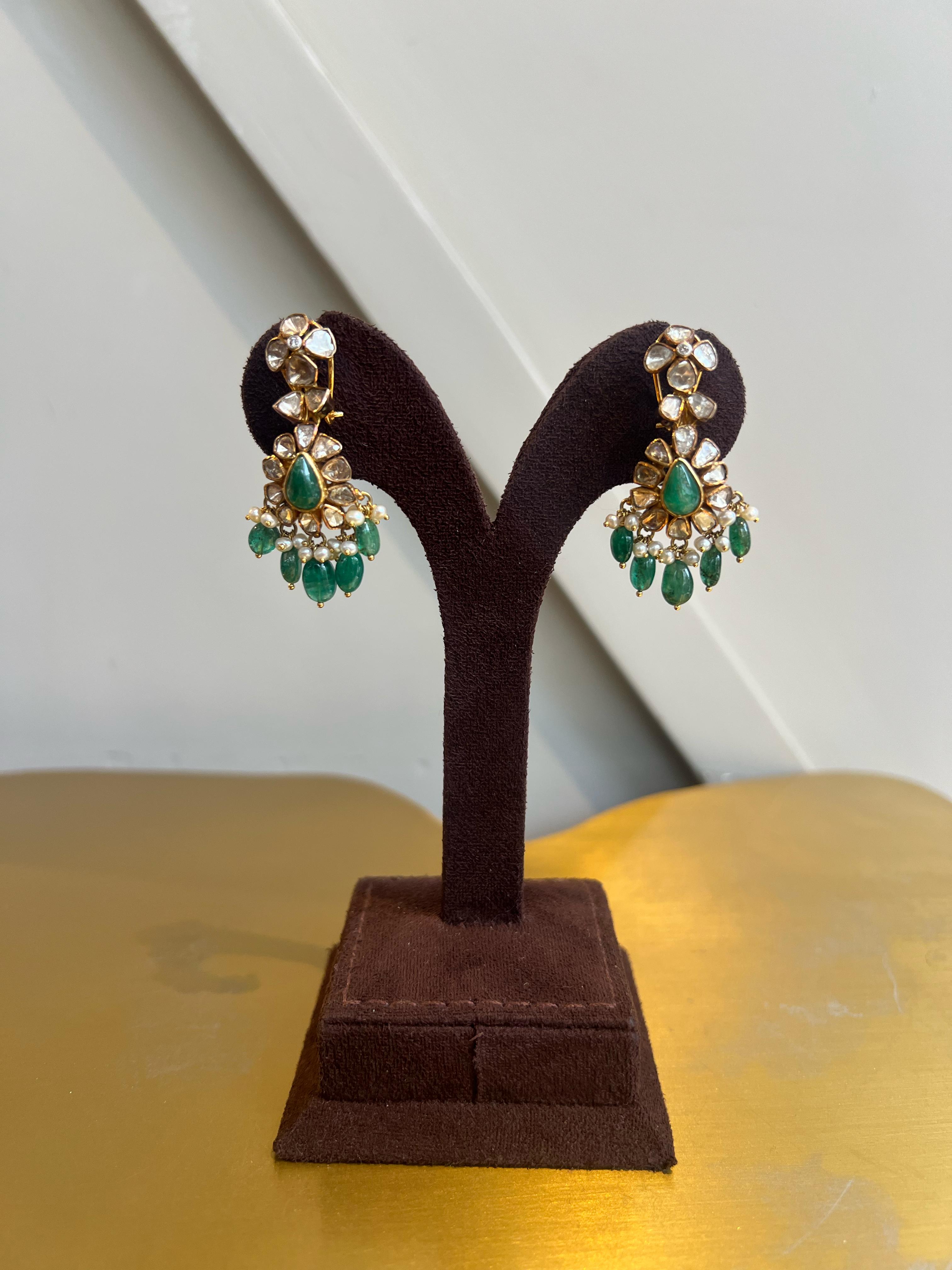 Polki earrings studded with Emerald Polki earrings studded with Emerald