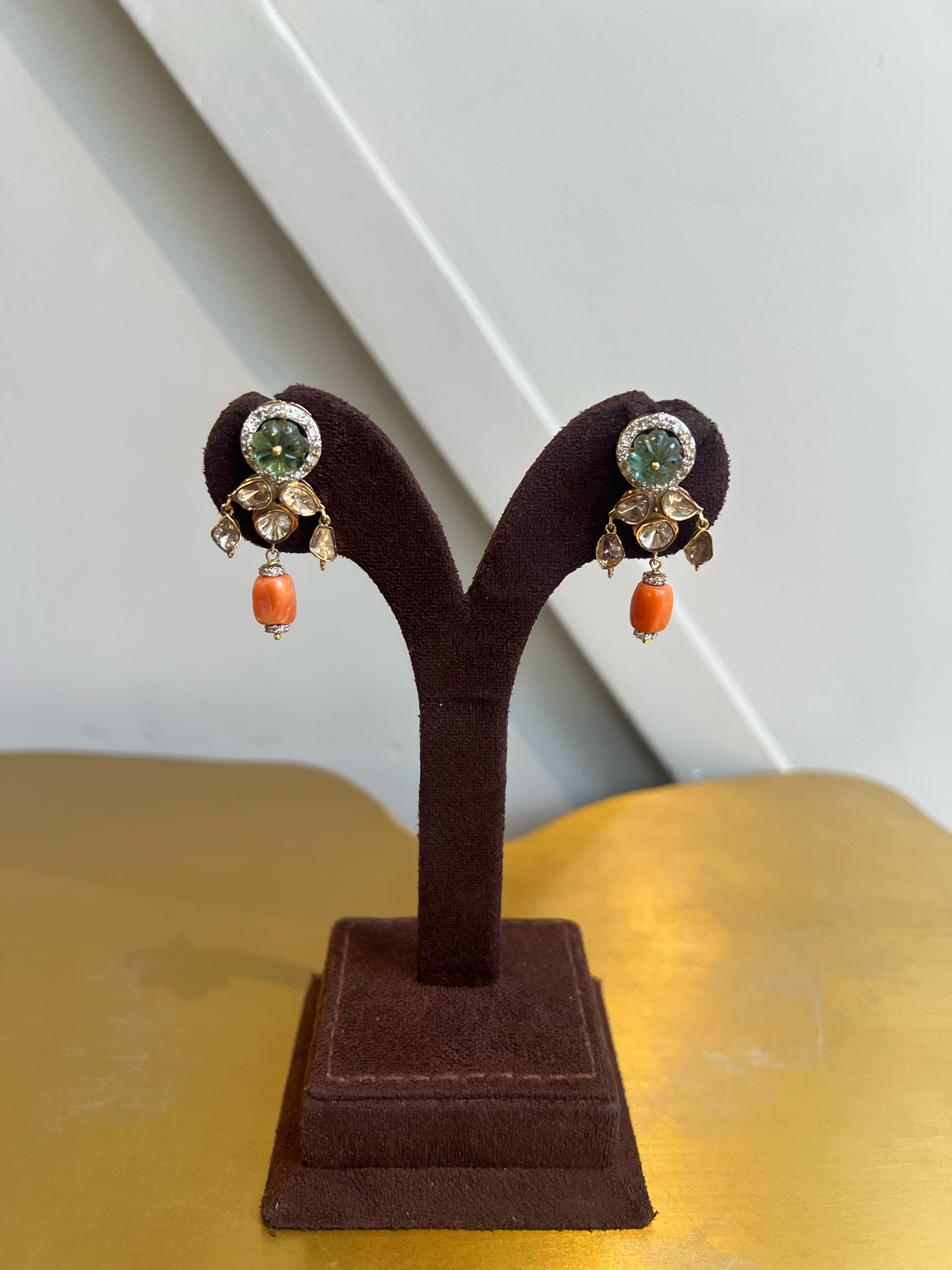 Polki earrings studded with Emerald and Corals Polki earrings studded with Emerald and Corals